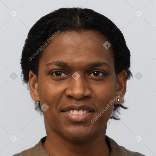 Joyful black young-adult female with short  black hair and brown eyes