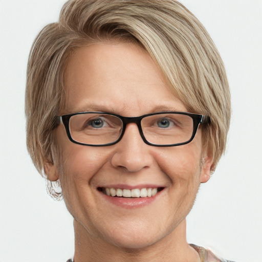 Joyful white adult female with short  brown hair and blue eyes