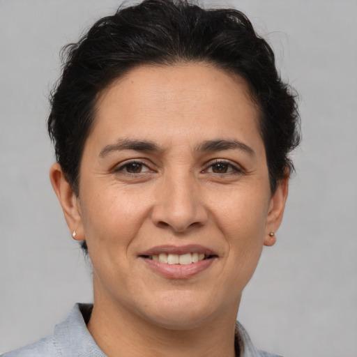 Joyful white adult female with short  brown hair and brown eyes