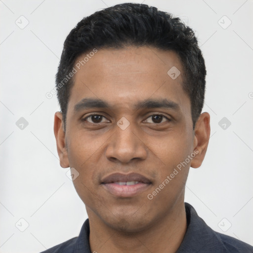 Joyful latino young-adult male with short  black hair and brown eyes