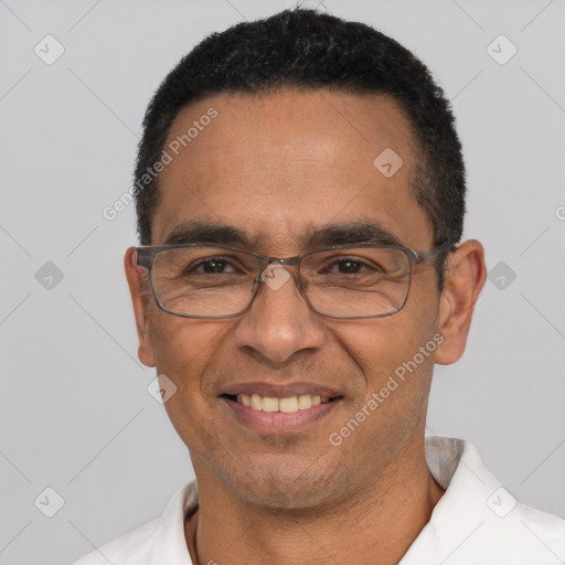 Joyful white adult male with short  black hair and brown eyes