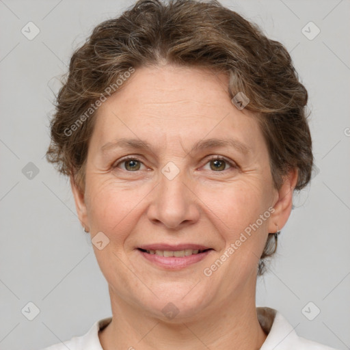 Joyful white adult female with short  brown hair and brown eyes