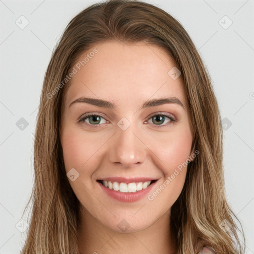 Joyful white young-adult female with long  brown hair and green eyes