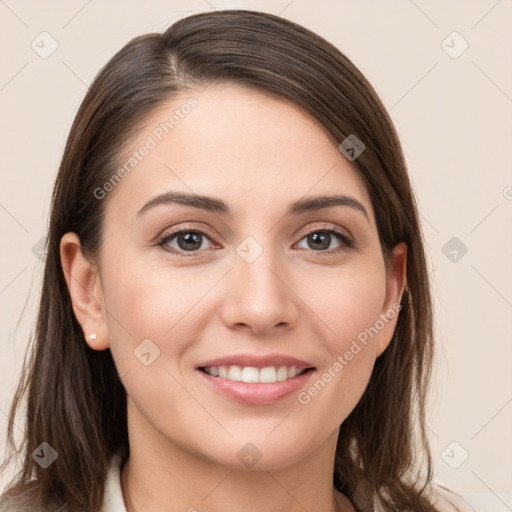 Joyful white young-adult female with long  brown hair and grey eyes