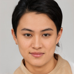 Joyful asian young-adult female with short  brown hair and brown eyes