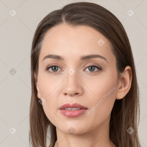 Neutral white young-adult female with long  brown hair and brown eyes