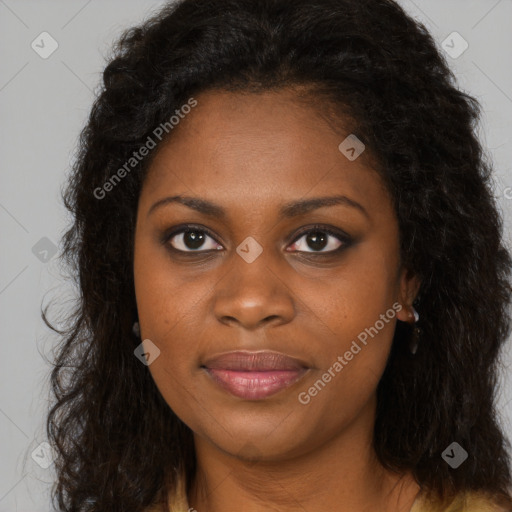 Joyful black young-adult female with long  brown hair and brown eyes