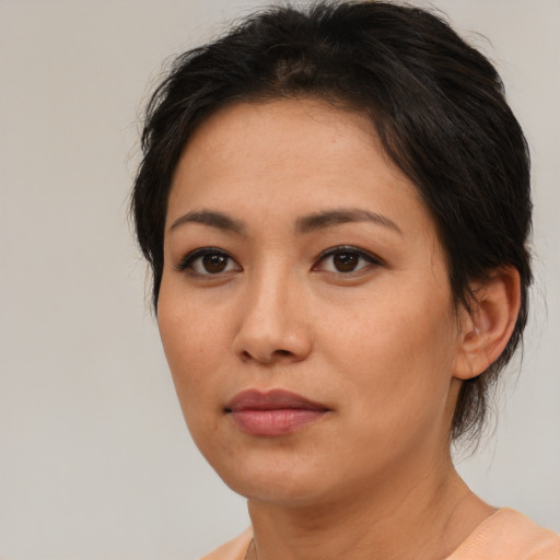 Neutral asian young-adult female with medium  brown hair and brown eyes