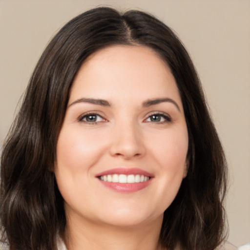 Joyful white young-adult female with medium  brown hair and brown eyes