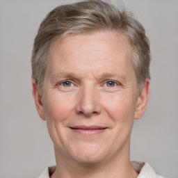 Joyful white adult male with short  brown hair and grey eyes