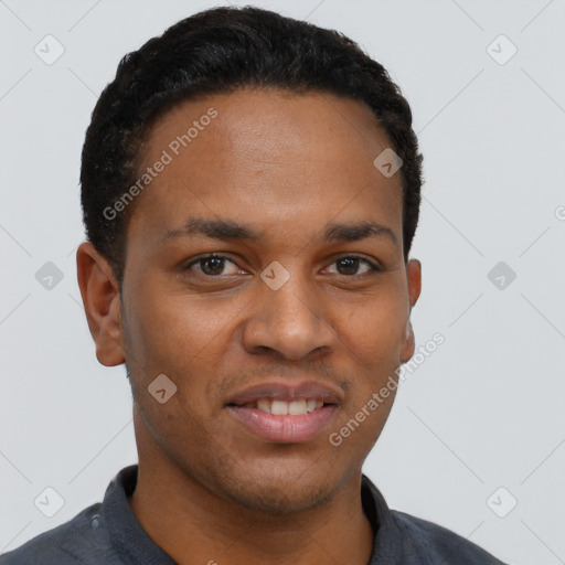 Joyful black young-adult male with short  black hair and brown eyes