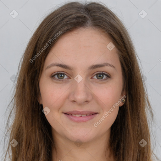 Joyful white young-adult female with long  brown hair and green eyes