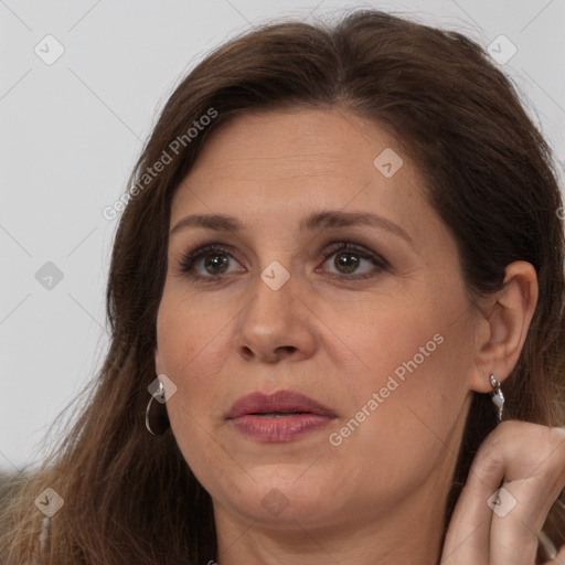 Joyful white adult female with medium  brown hair and brown eyes