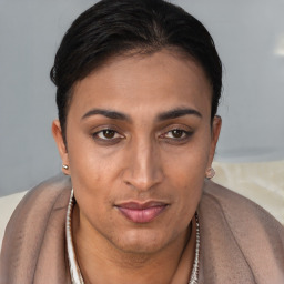 Joyful latino young-adult female with short  brown hair and brown eyes