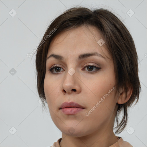 Neutral white young-adult female with medium  brown hair and brown eyes