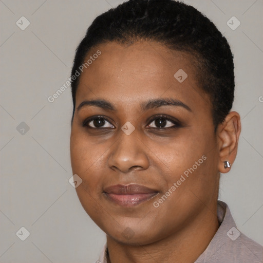 Joyful black young-adult female with short  black hair and brown eyes