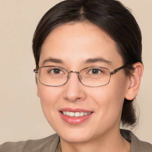 Joyful white young-adult female with medium  brown hair and brown eyes