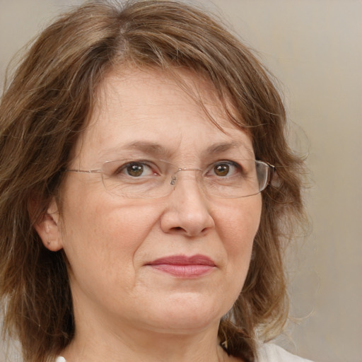 Joyful white middle-aged female with medium  brown hair and green eyes