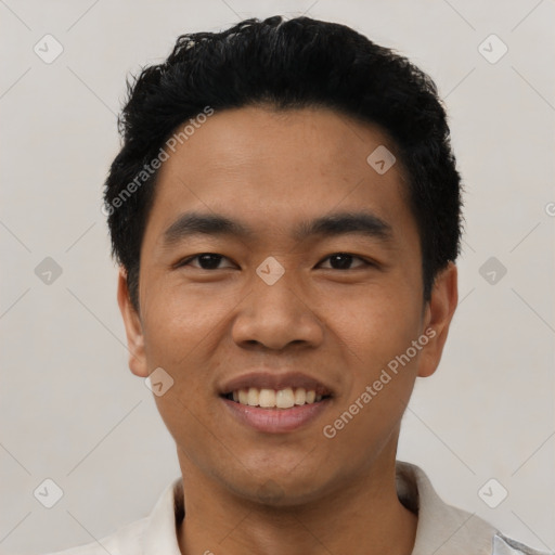 Joyful asian young-adult male with short  black hair and brown eyes