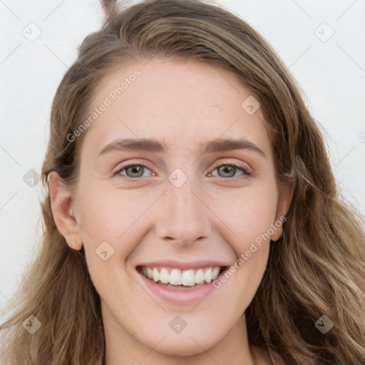 Joyful white young-adult female with long  brown hair and blue eyes