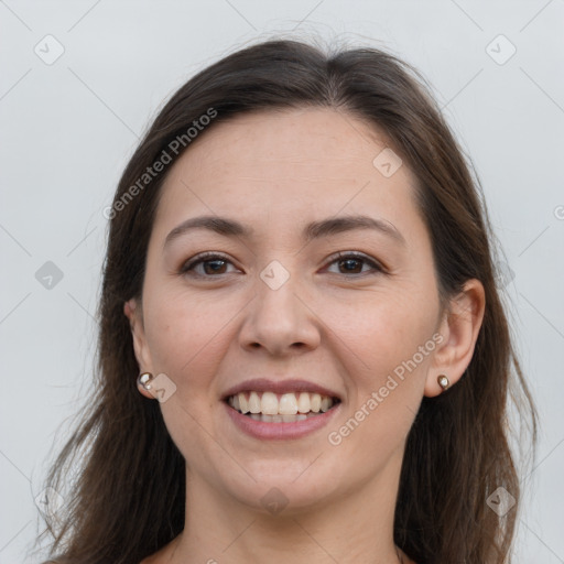 Joyful white young-adult female with long  brown hair and grey eyes