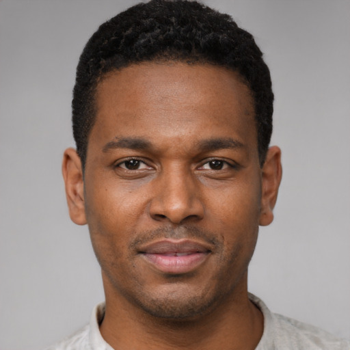Neutral black young-adult male with short  black hair and brown eyes