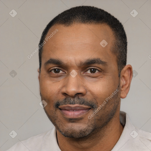 Joyful latino adult male with short  black hair and brown eyes