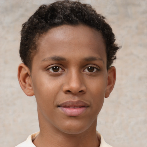 Joyful black young-adult male with short  brown hair and brown eyes
