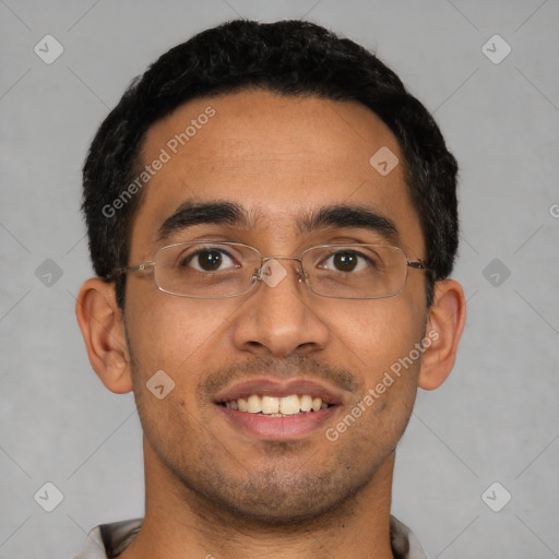 Joyful latino young-adult male with short  black hair and brown eyes