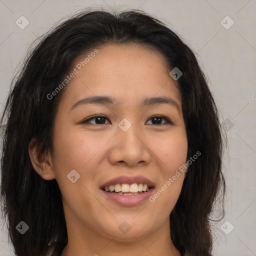 Joyful latino young-adult female with long  brown hair and brown eyes