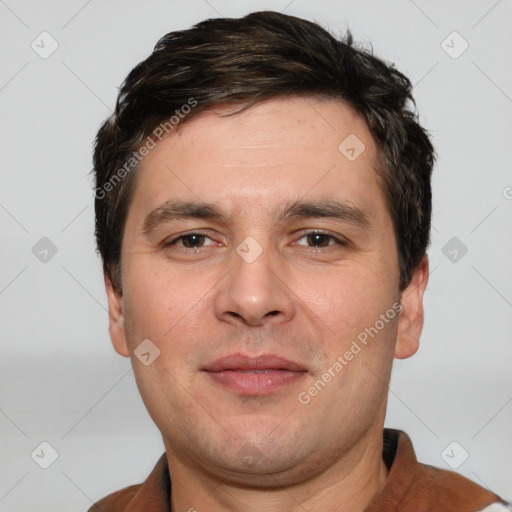 Joyful white young-adult male with short  brown hair and brown eyes