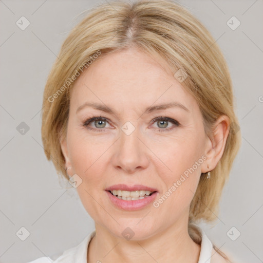 Joyful white adult female with medium  brown hair and grey eyes