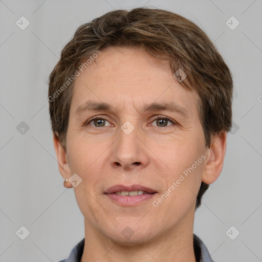 Joyful white adult male with short  brown hair and grey eyes