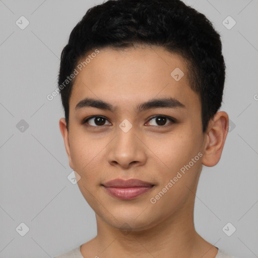 Joyful latino young-adult male with short  black hair and brown eyes