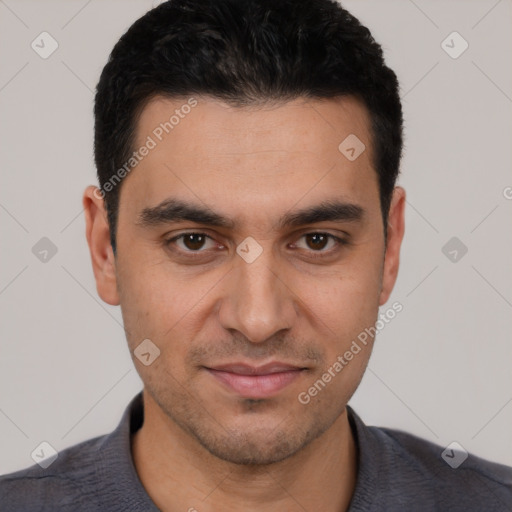 Joyful white young-adult male with short  black hair and brown eyes