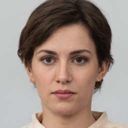 Neutral white young-adult female with short  brown hair and brown eyes