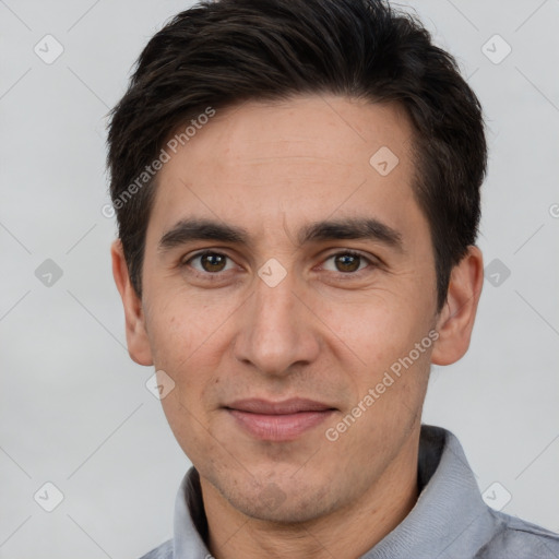 Joyful white adult male with short  brown hair and brown eyes