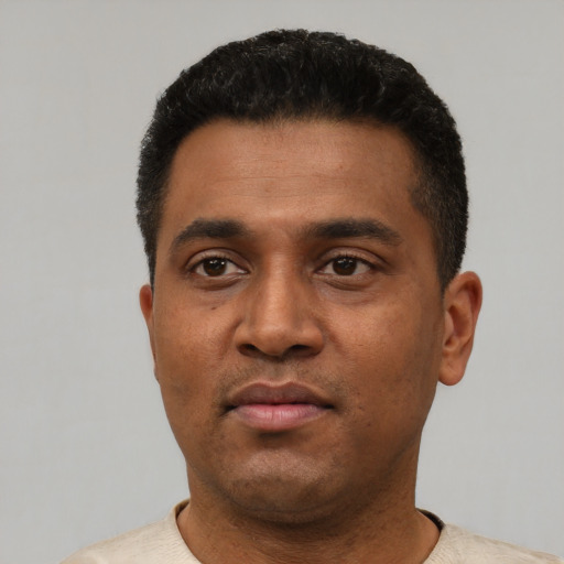 Neutral latino young-adult male with short  black hair and brown eyes