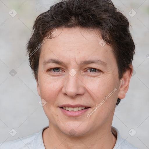 Joyful white adult female with short  brown hair and brown eyes