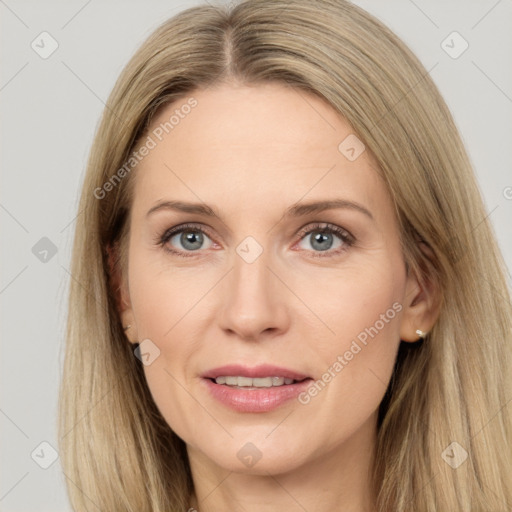 Joyful white adult female with long  brown hair and grey eyes