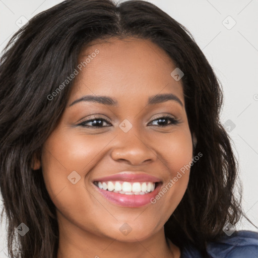 Joyful latino young-adult female with long  brown hair and brown eyes