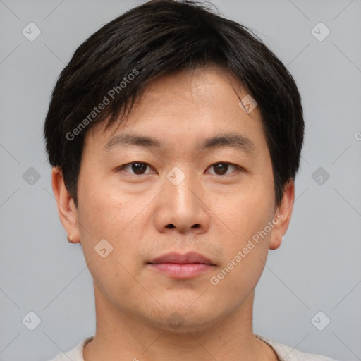 Neutral asian young-adult male with short  brown hair and brown eyes