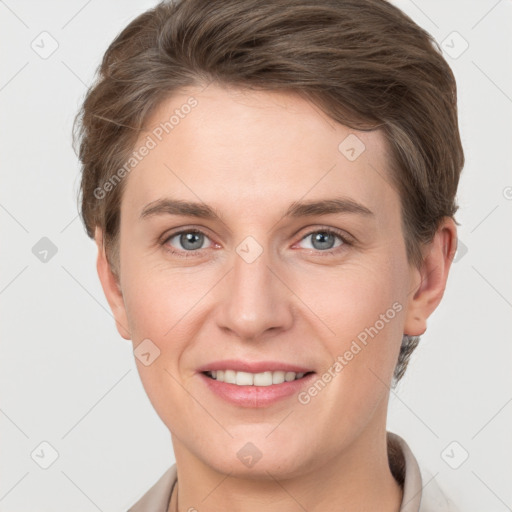 Joyful white young-adult female with short  brown hair and grey eyes