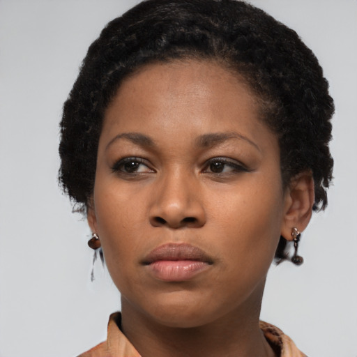 Neutral black young-adult female with short  brown hair and brown eyes