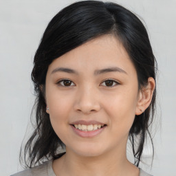 Joyful asian young-adult female with medium  black hair and brown eyes