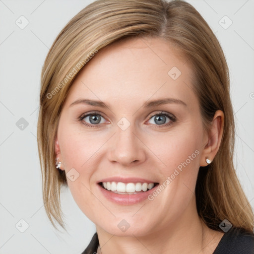 Joyful white young-adult female with medium  brown hair and blue eyes