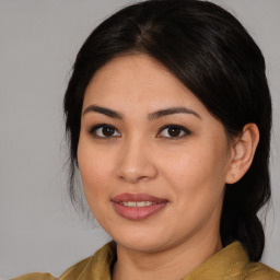 Joyful asian young-adult female with medium  brown hair and brown eyes