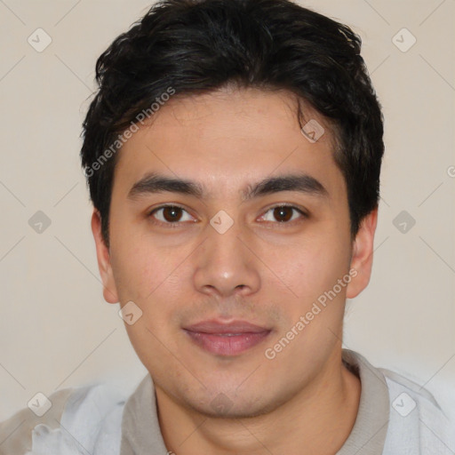 Joyful latino young-adult male with short  brown hair and brown eyes