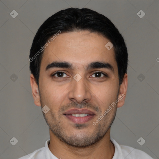 Joyful latino young-adult male with short  black hair and brown eyes