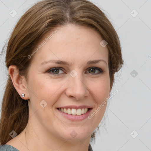 Joyful white adult female with medium  brown hair and grey eyes